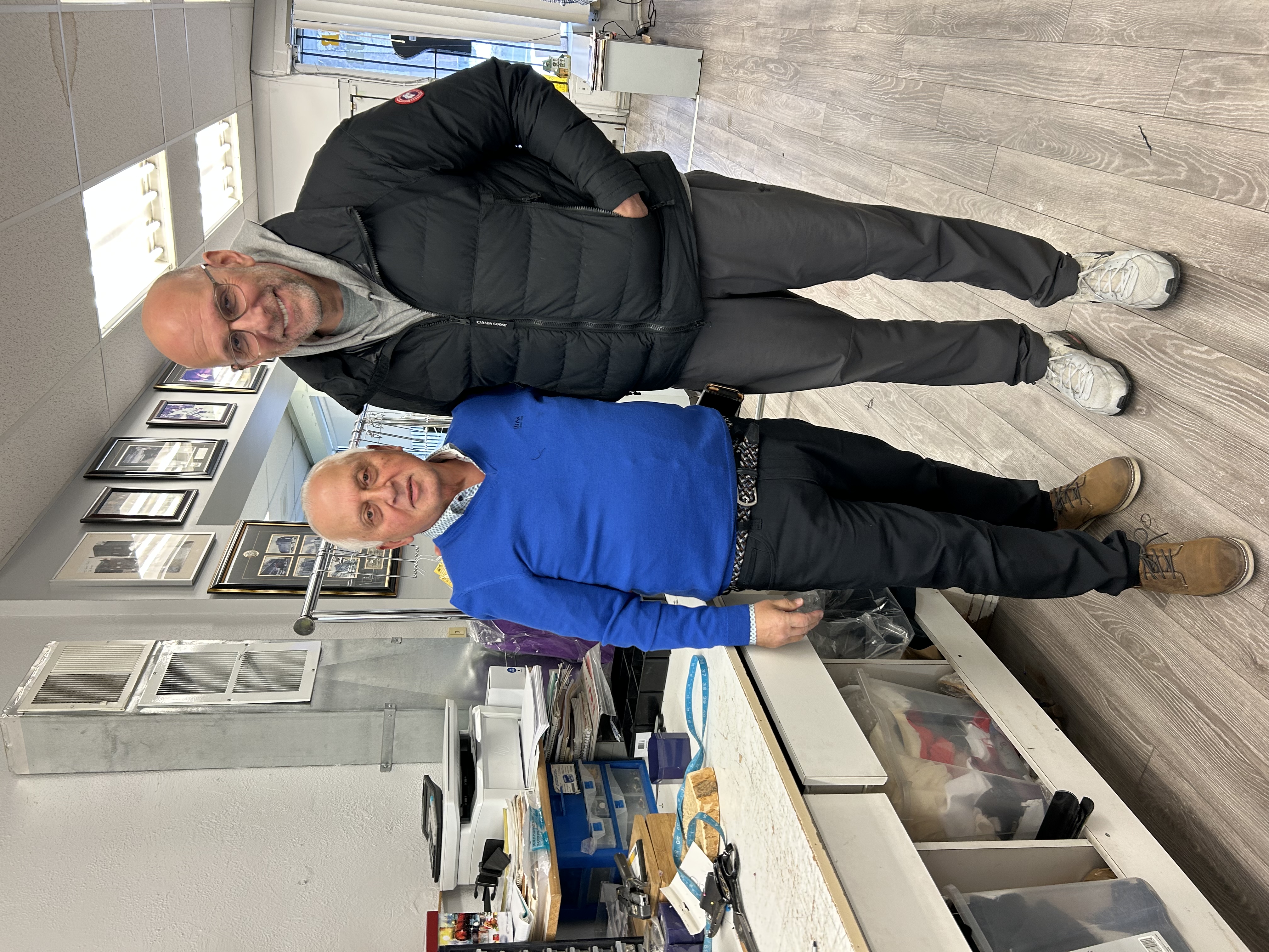 Dan Shulman — sportscaster — with the master tailor at Paul's Tailors